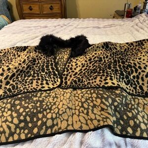 Leopard print cape with faux fur collar.